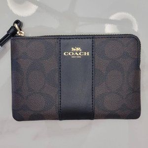 COACH CORNER ZIP WRISTLET IN SIGNATURE CANVAS BLACK/BROWN
